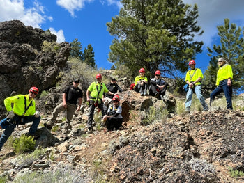 SAR team group photo on rocky outcrop