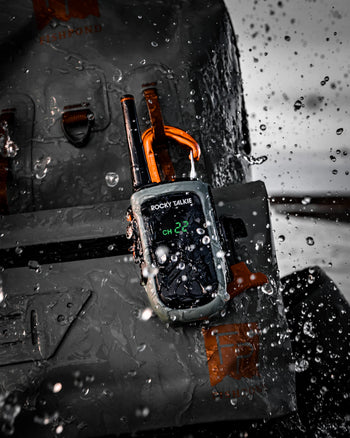 Rocky Talkie radio attached to a tire with water droplets on the surface