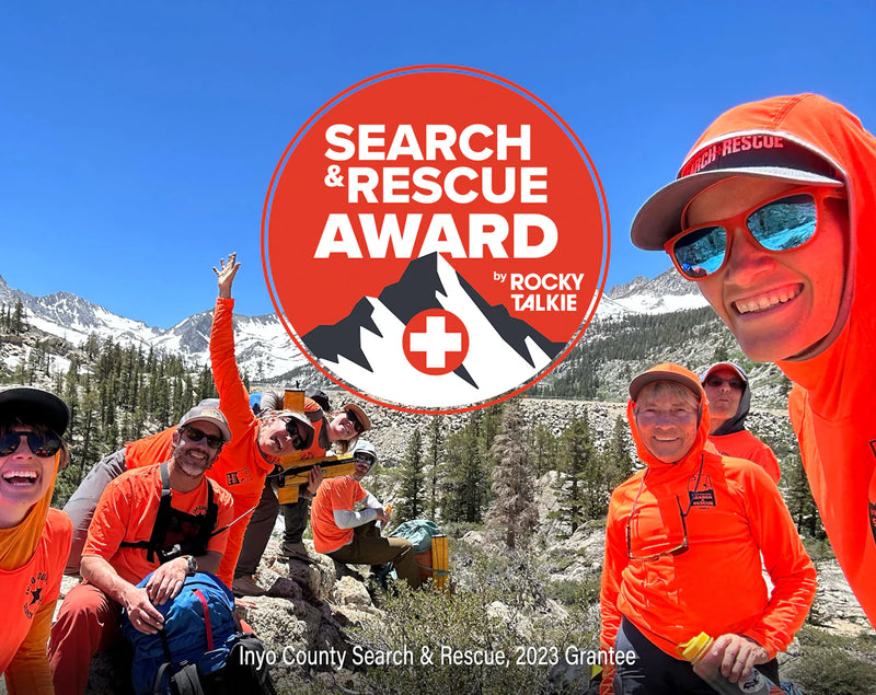 search and rescue team in orange shirts with logo