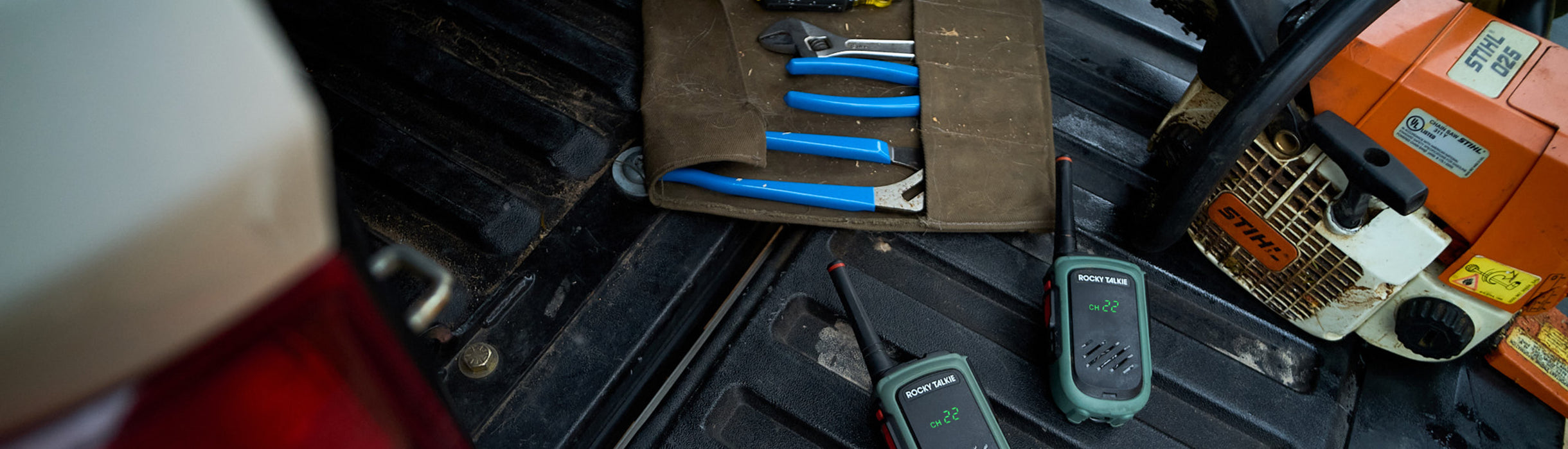 Tool kit and chainsaw on a truck bed