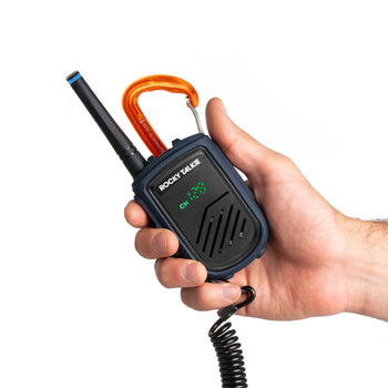 Hand holding a Rocky Talkie walkie talkie on a white background