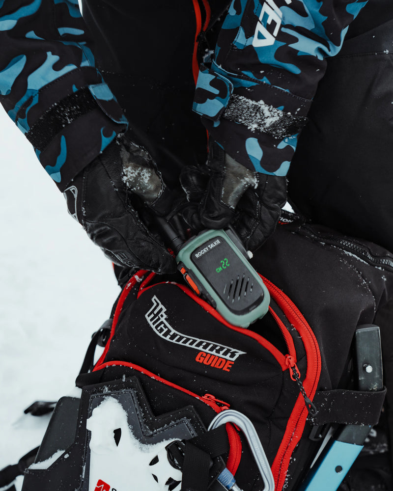 Radio being placed into backpack